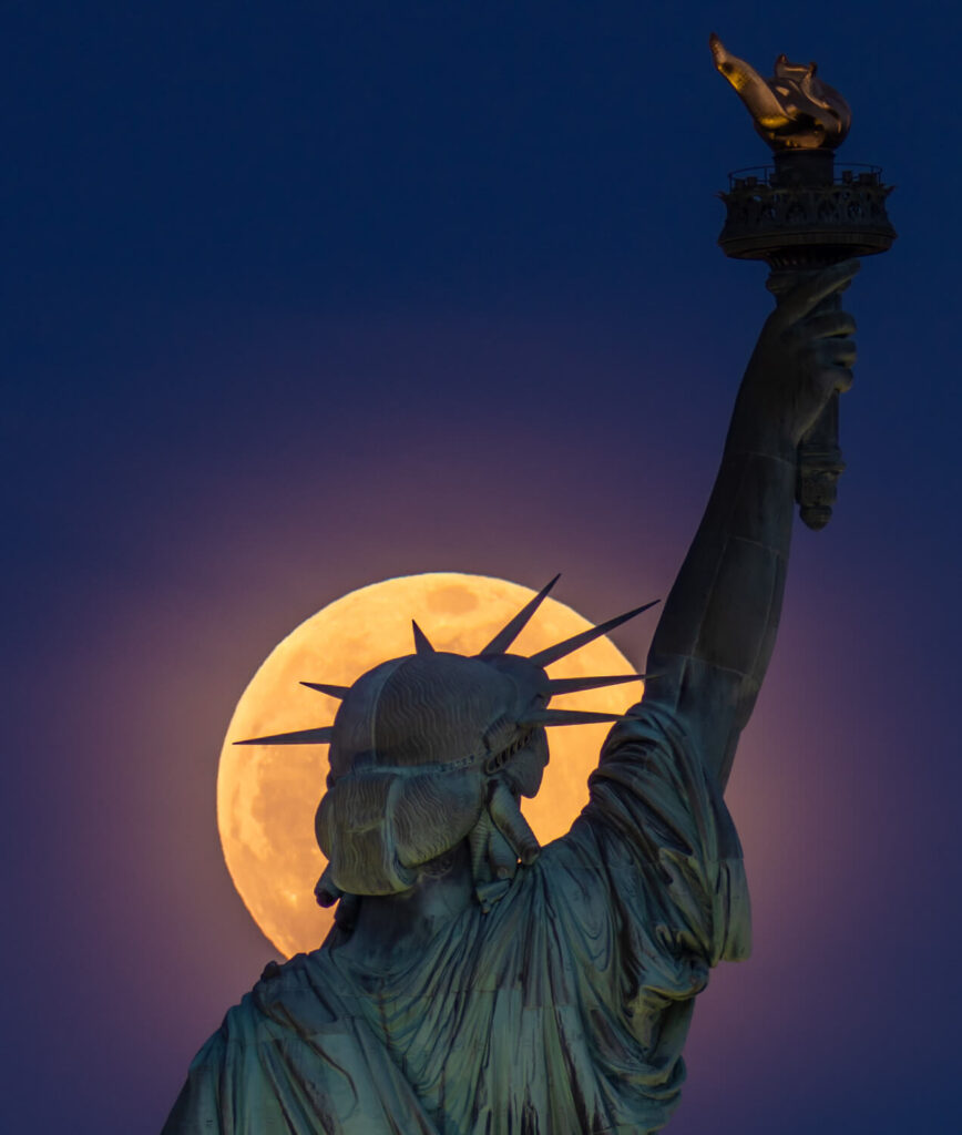 harvest-moon-behind-statue-of-liberty